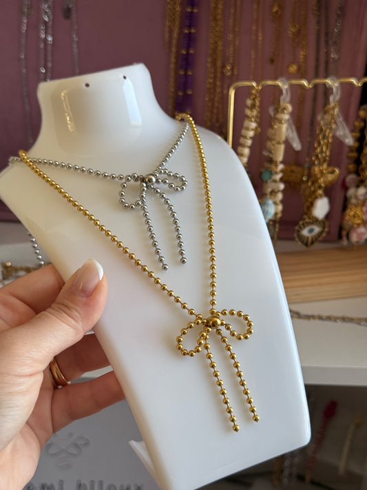 Collana fiocchetto di sferette