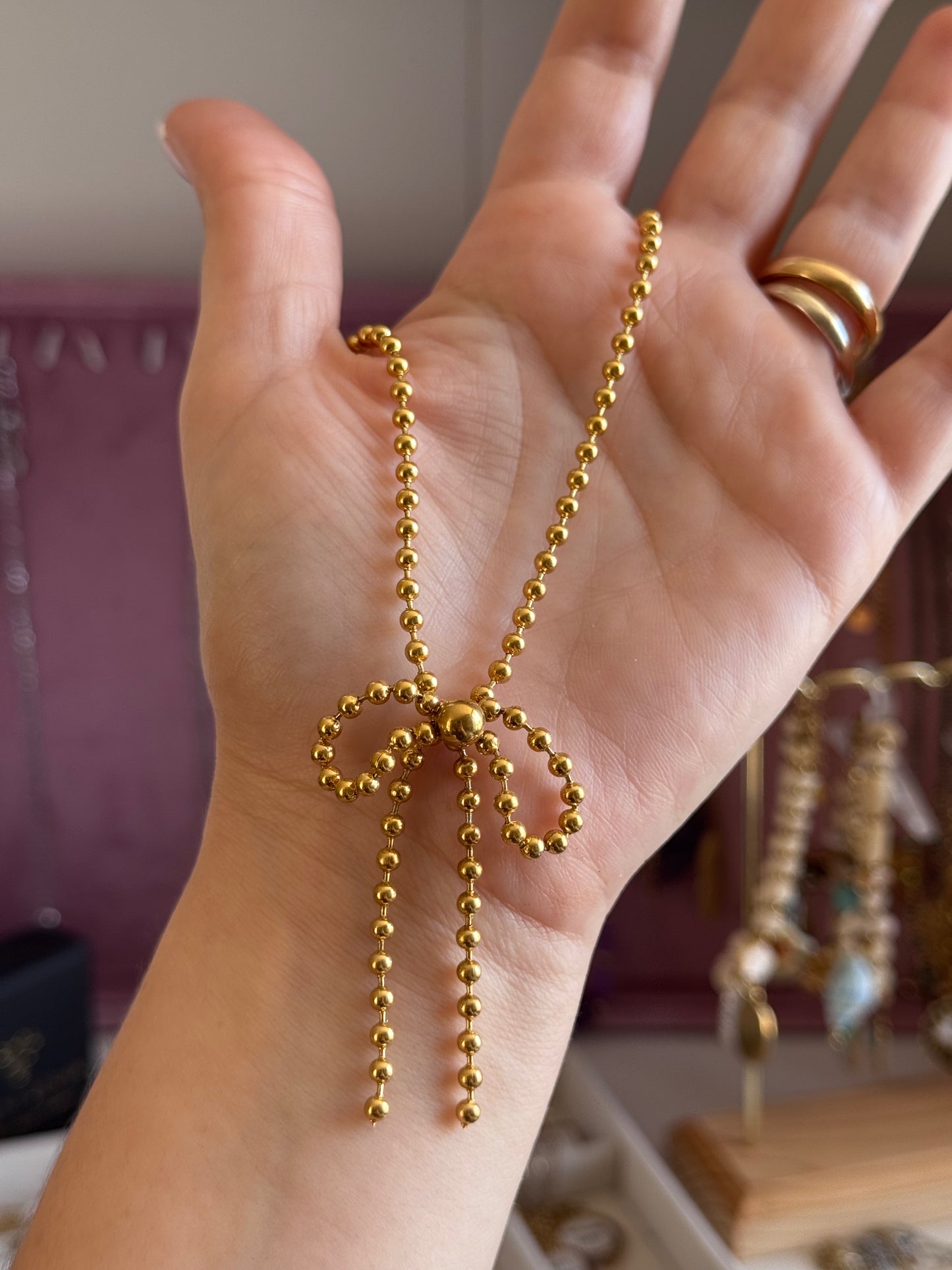 Collana fiocchetto di sferette